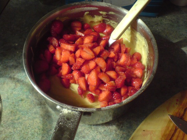 Strawberries on top of cake mix